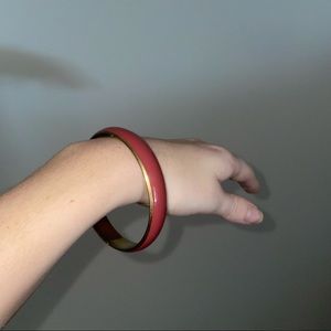 pinkish-red bangle bracelet